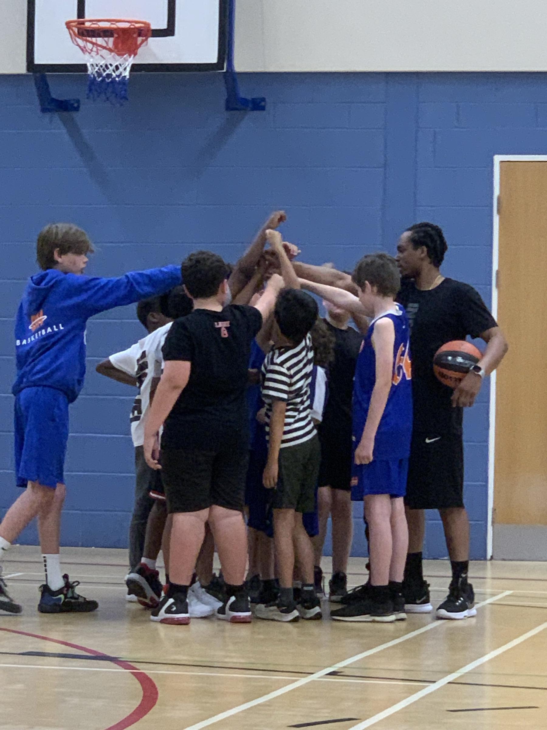 Coach J working with athletes during training